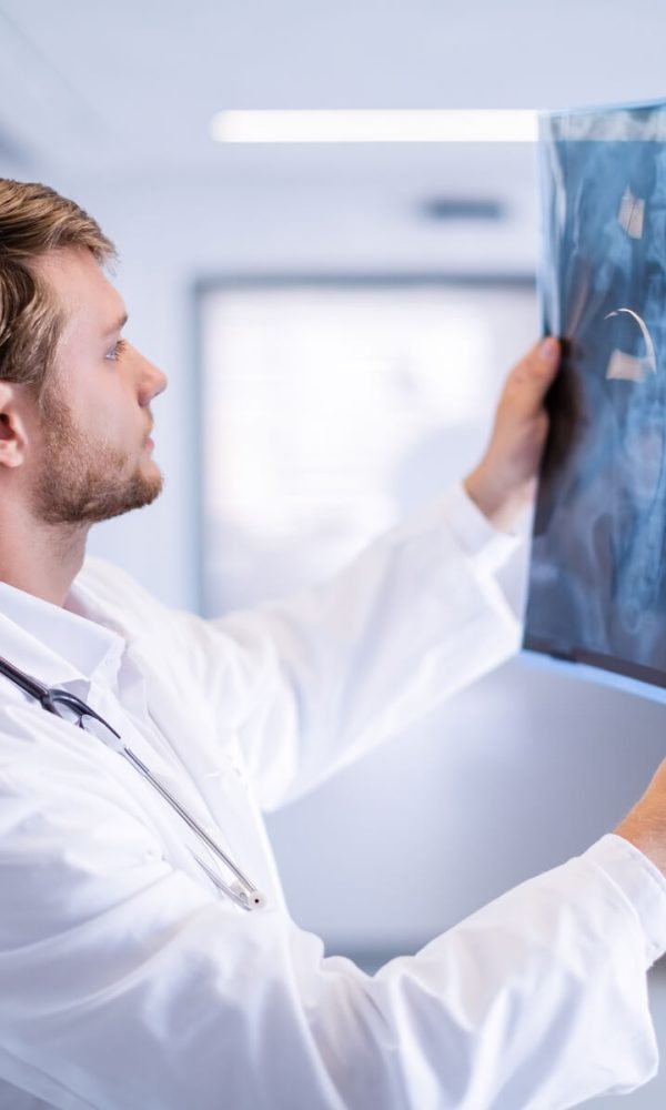 male-doctor-examining-x-ray-in-corridor-2023-11-27-05-07-50-utc_crop.jpg